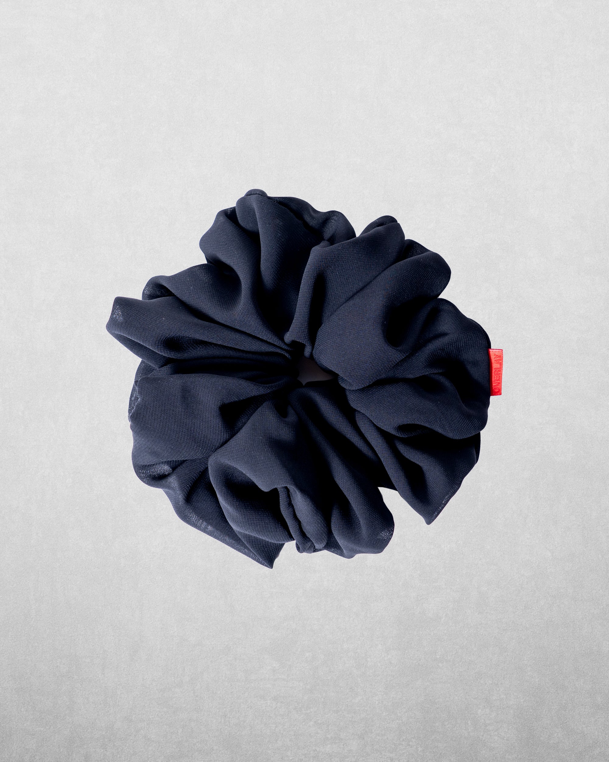 Overlay chiffon scrunchies are the perfect blend of function and elegance. Designed to provide a secure yet gentle hold, they add volume without tugging, making them ideal for styling your hijab with ease and comfort.