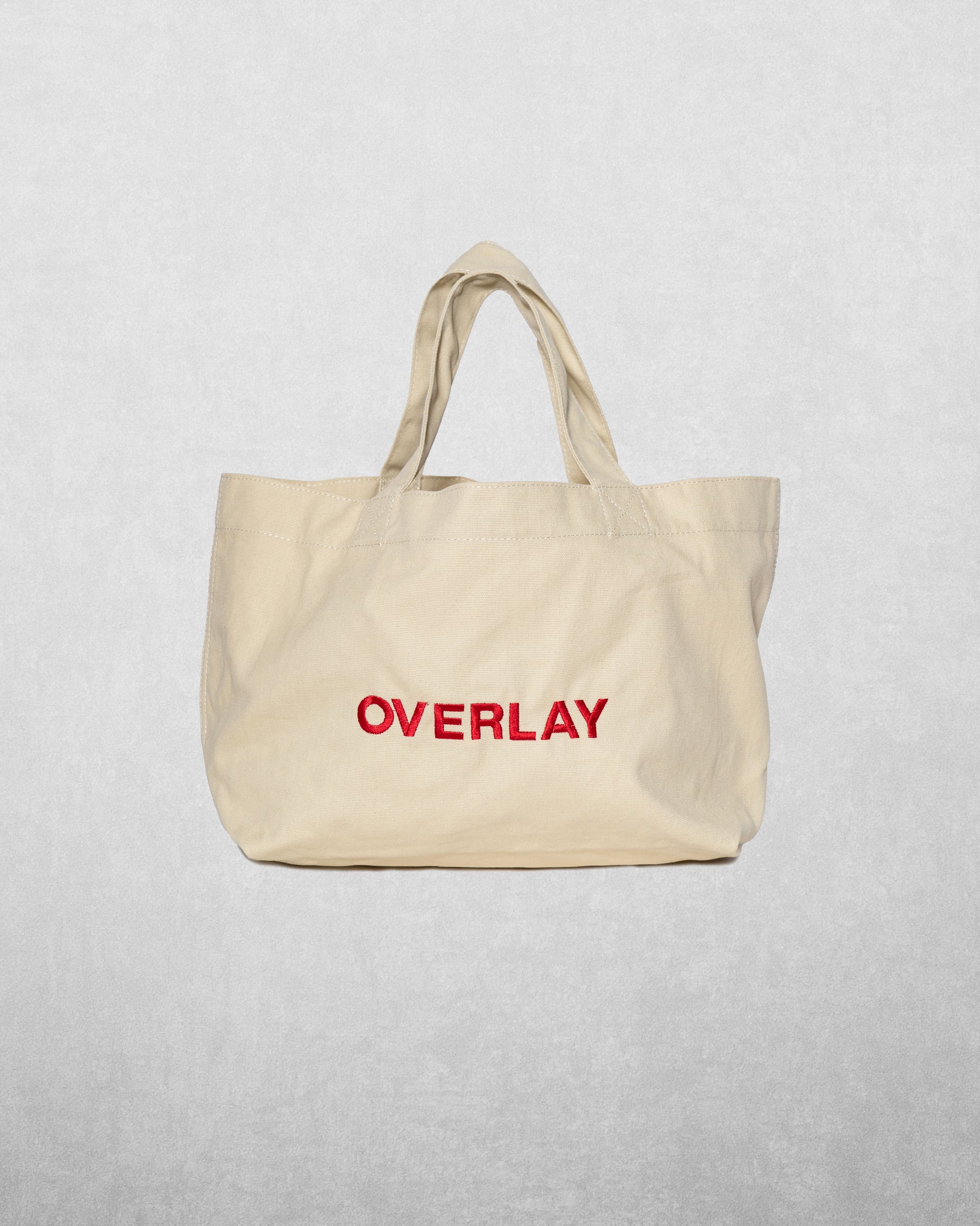 Elevate your everyday style with the Overlay beige tote bag – the perfect blend of function and fashion. Crafted with high-quality materials, this tote bag offers a spacious, effortlessly chic design that is both practical and stylish.